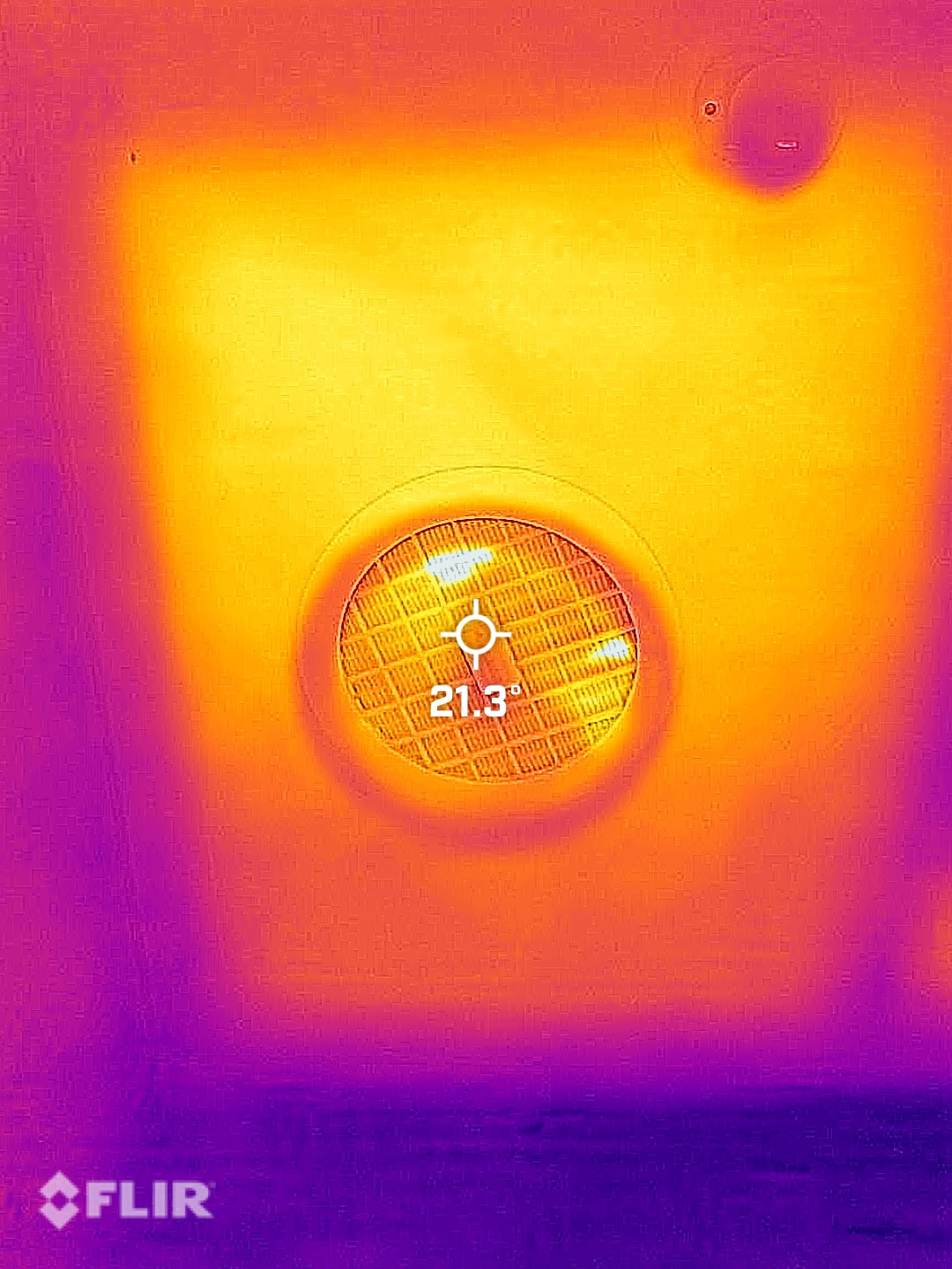 Thermal image of a ceiling fan with a missing insulation batt