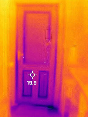 Termal image showing air leaks around a door